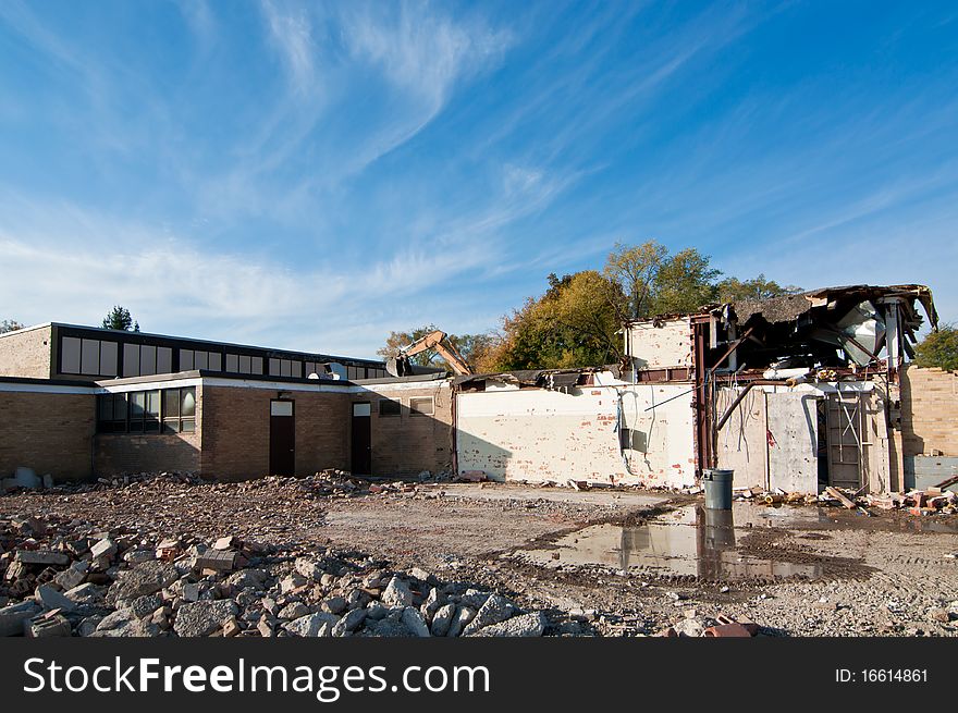 An old high school building that is being torn down. An old high school building that is being torn down.