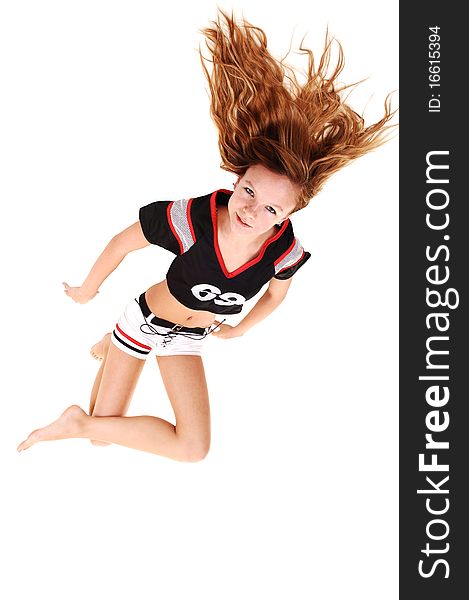 A young teenage soccer girl lying on the floor in her uniform,
for a portrait in the studio, over white background. A young teenage soccer girl lying on the floor in her uniform,
for a portrait in the studio, over white background.