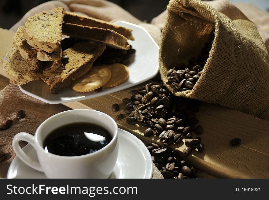 Breakfast with coffee, bread and biscuits.