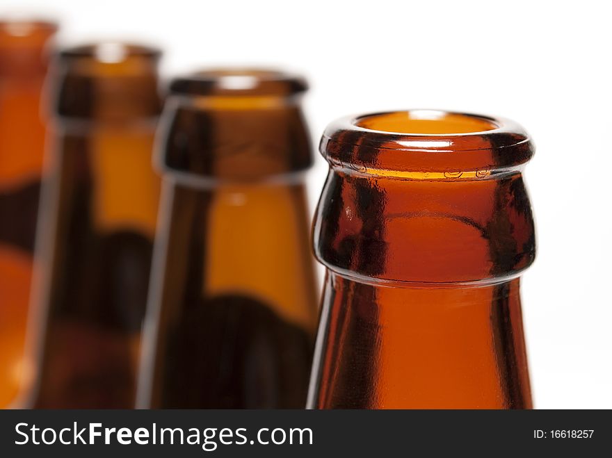 Brown bottle placement in a row on a white background