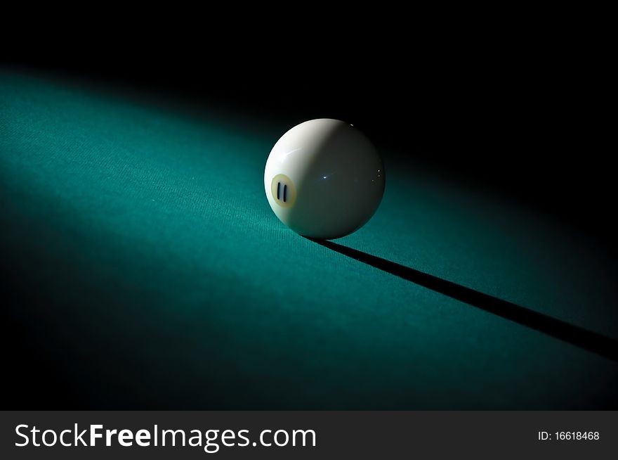 Billiard ball on green linen