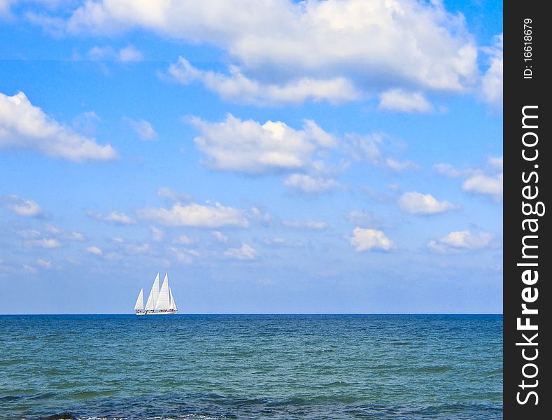 boat with white sails at sea. boat with white sails at sea