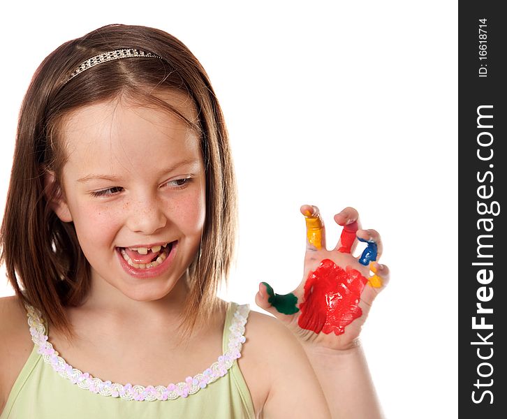 Eight year old girl with hand painted in colorful paints ready for hand prints. Eight year old girl with hand painted in colorful paints ready for hand prints