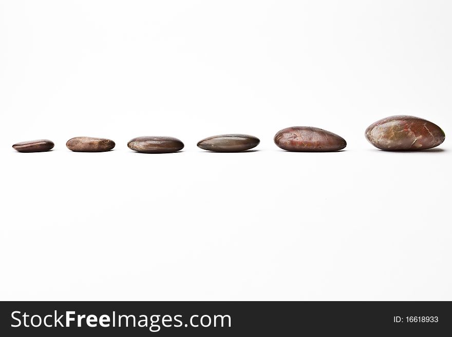 A shot of river pebbles in a strait formation.