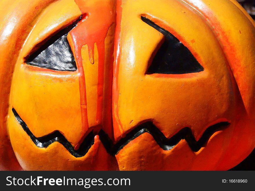 An orange halloween pumpkin with blood