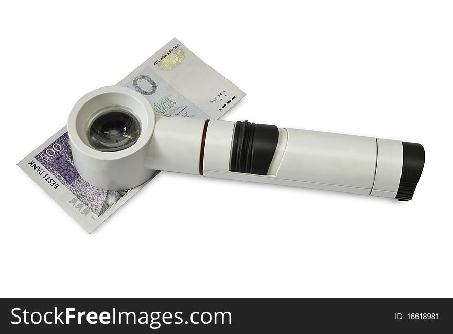 Magnifying glass verifies the authenticity of money. Magnifying glass verifies the authenticity of money