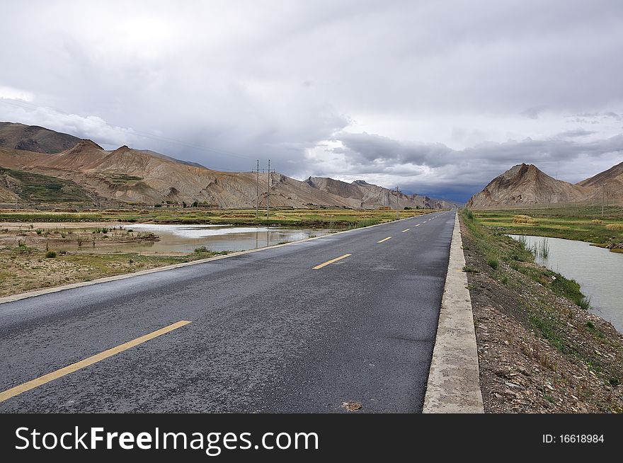 The highway of tibet is wide,open and opaque.What a beautiful landscape. The highway of tibet is wide,open and opaque.What a beautiful landscape.