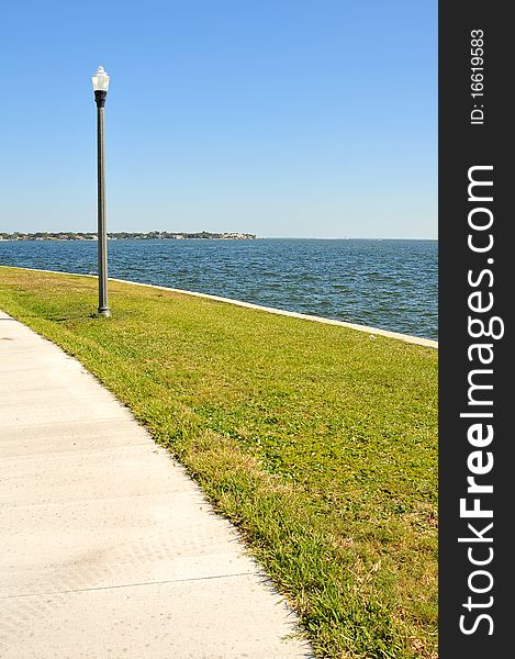 Well placed street lamp for pedestrians to walk, jog or sightsee near the water of Tampa Bay. Well placed street lamp for pedestrians to walk, jog or sightsee near the water of Tampa Bay.