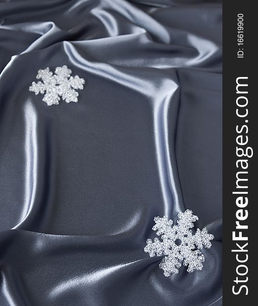 Satin background with Christmas decorations; place for your object. Satin background with Christmas decorations; place for your object