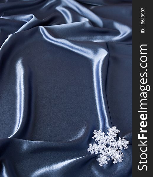 Satin background with Christmas decorations; place for your object. Satin background with Christmas decorations; place for your object