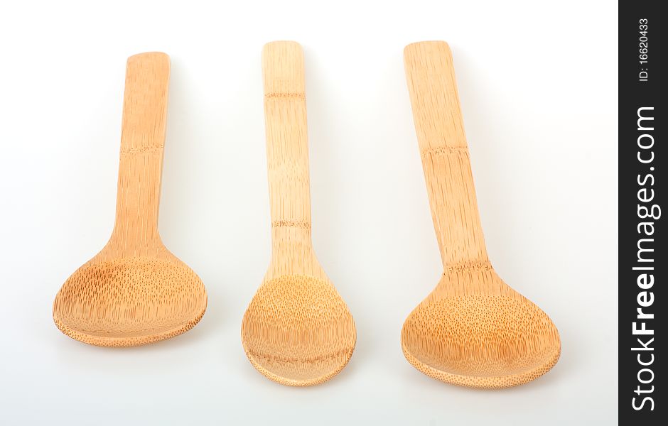 Set of wooden kitchen cooking spoons on a white background. Set of wooden kitchen cooking spoons on a white background