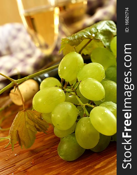 Fresh grapes, vine and vine bottle, holiday background