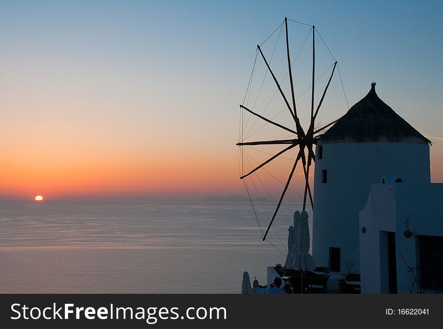 Windmill in a sunset at Oia, Santorini. Windmill in a sunset at Oia, Santorini