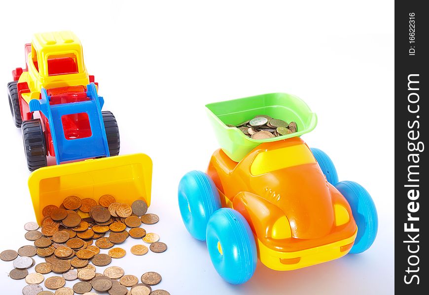 Toy loader loads the coin into the truck. Investment, loans.