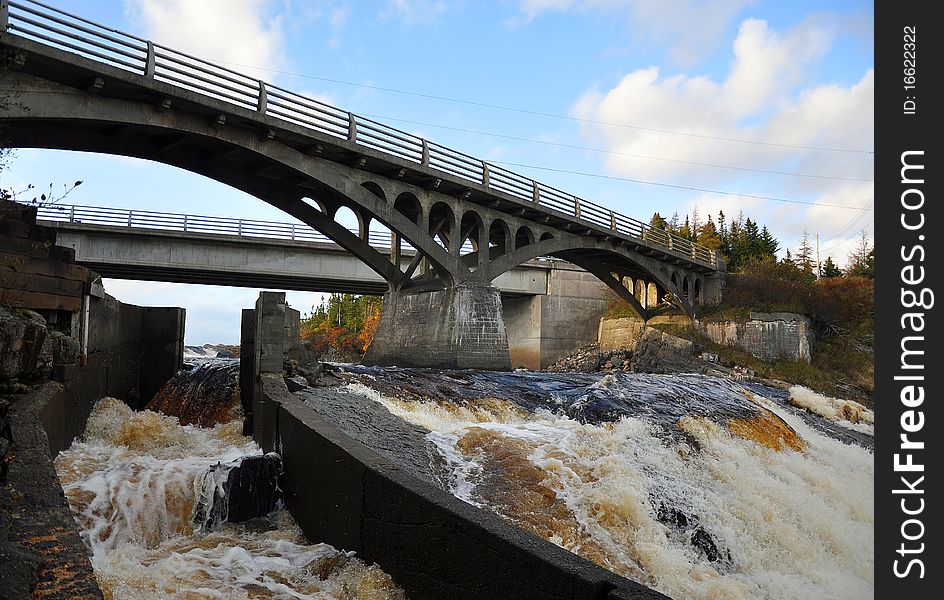 This rapid running river in Newfoundland proved to difficult for spawning salmon to navigate. A special salmon ladder [shown on the left] was designed to allow salmon to get over the falls and continue on to their spawning grounds. This rapid running river in Newfoundland proved to difficult for spawning salmon to navigate. A special salmon ladder [shown on the left] was designed to allow salmon to get over the falls and continue on to their spawning grounds.