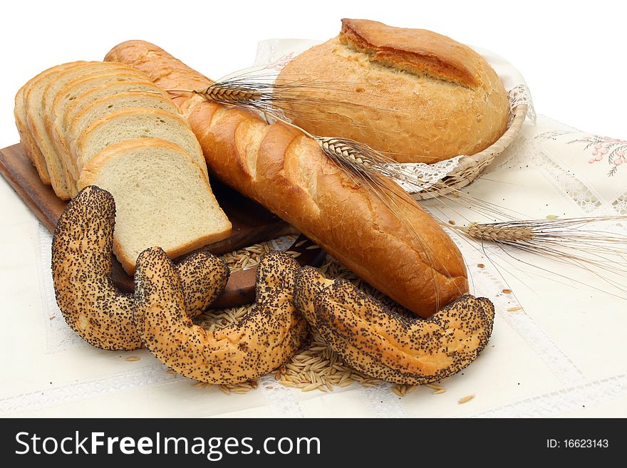 Group of different bread products on white