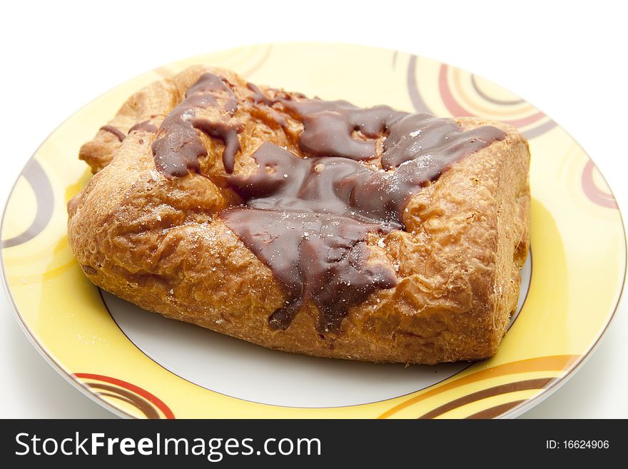 Pastry with chocolate filling and onto plates