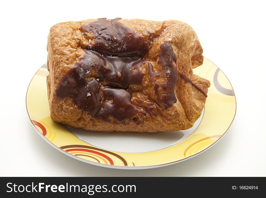 Pastry with chocolate filling and onto plates