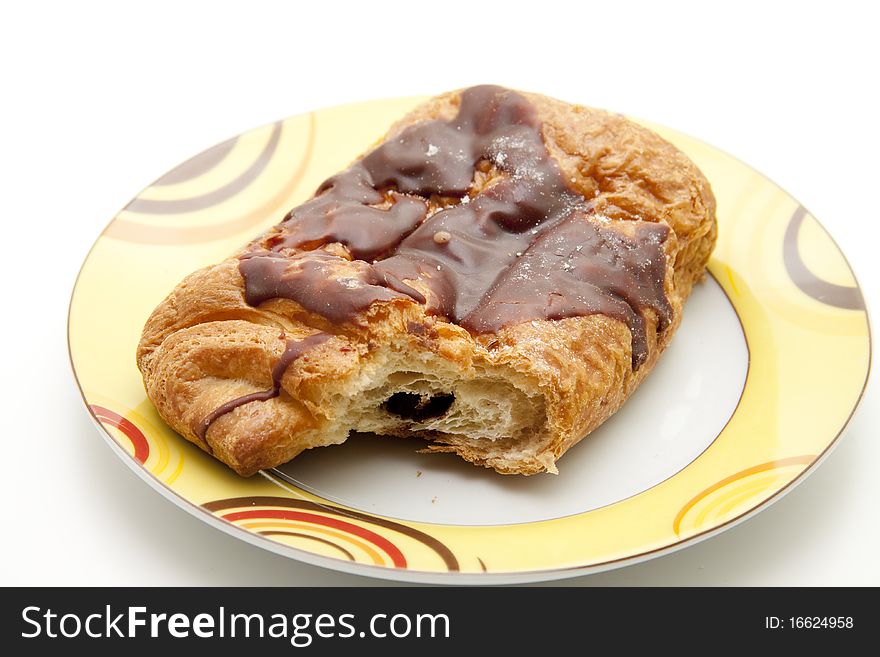 Pastry with chocolate filling and onto plates