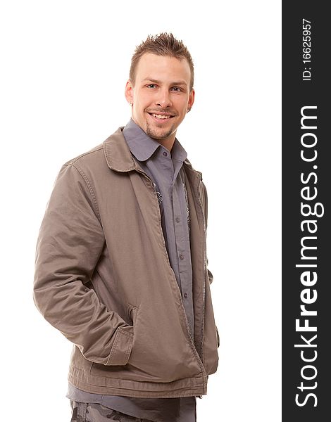 Young handsome man in jacket standing on white background