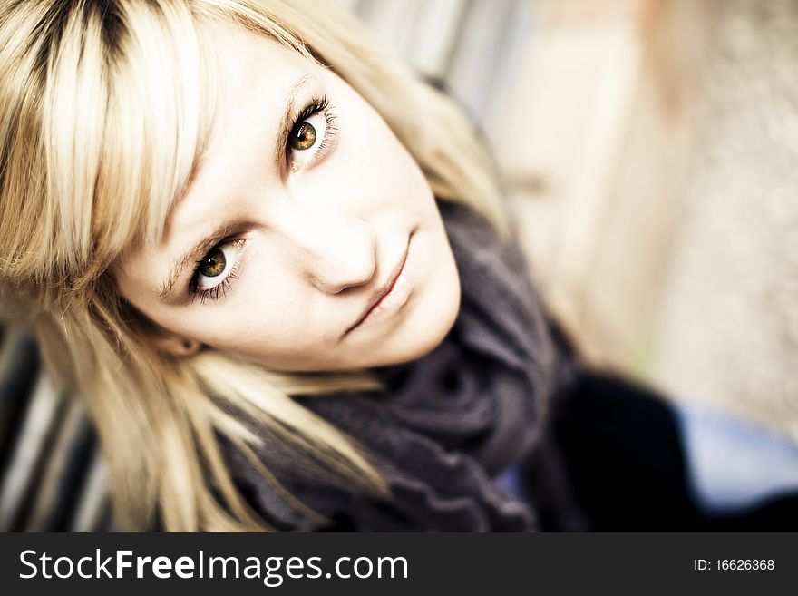 Young beautiful blonde staring at camera from below