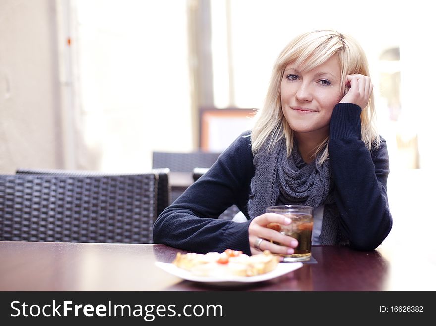 Portrait of young beautiful happy woman with ice tea. Portrait of young beautiful happy woman with ice tea