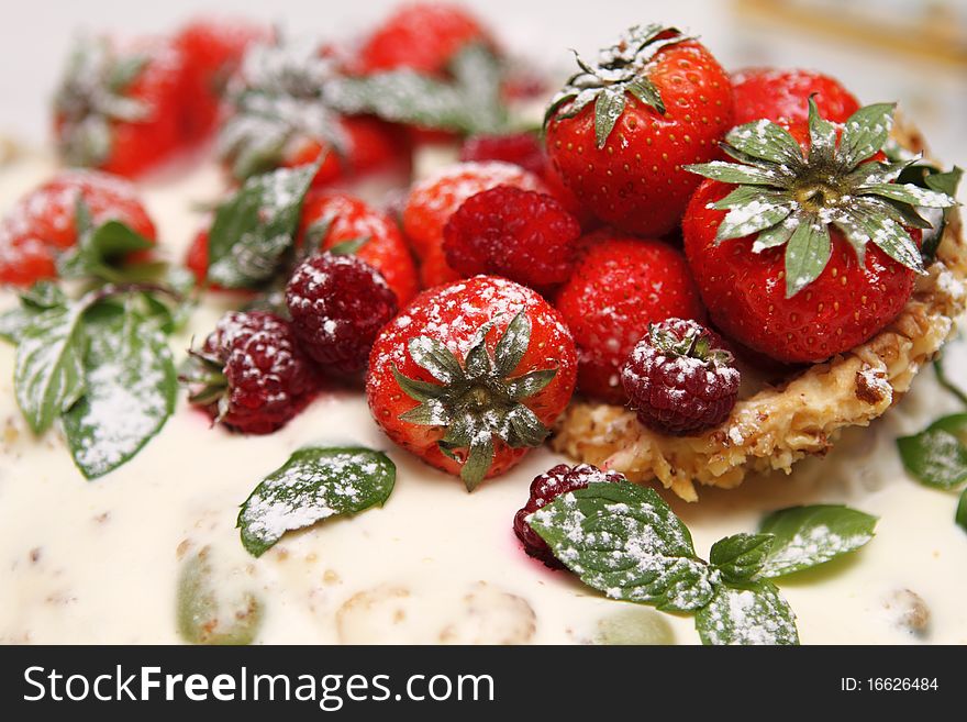 Detail of the cake with strawberryand raspberry. Detail of the cake with strawberryand raspberry