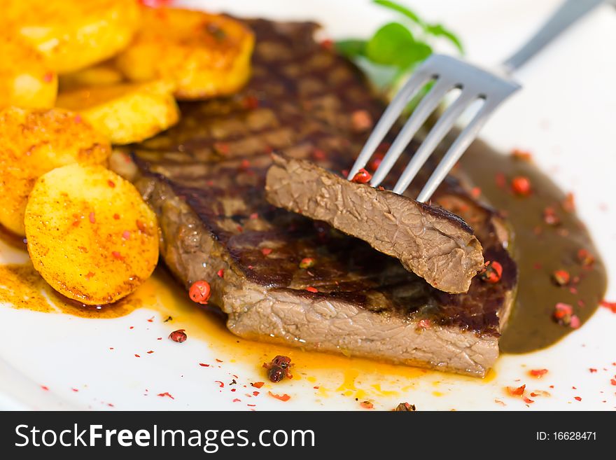 Steak with deep fried Potato . Steak with deep fried Potato .