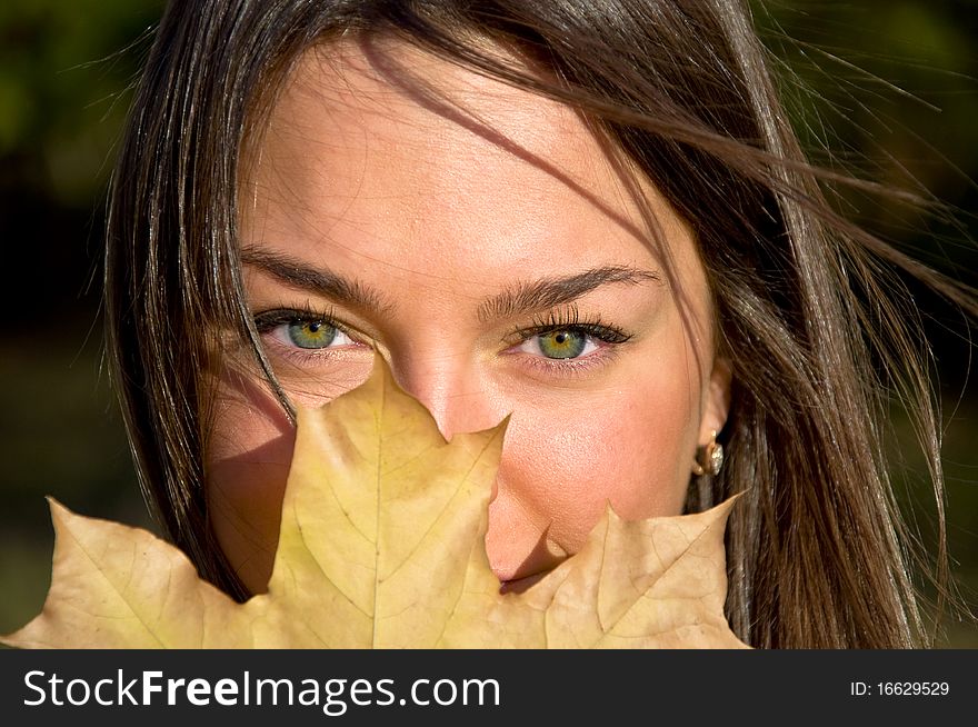 Woman holding a maple leaf