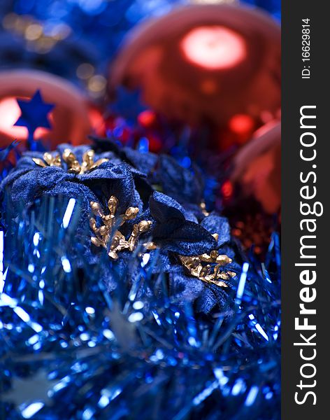 Red Christmas balls with blue tinsel close-up. Red Christmas balls with blue tinsel close-up