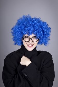 Funny Blue-hair Girl In Glasses And Black Coat. Stock Photography Funny Blue-hair Girl In Glasses And Black Coat. Stock Photography