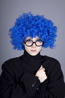 Funny Blue-hair Girl In Glasses And Black Coat. Stock Photos Funny Blue-hair Girl In Glasses And Black Coat. Stock Photos