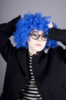 Funny Blue-hair Girl In Glasses And Black Coat. Stock Photography Funny Blue-hair Girl In Glasses And Black Coat. Stock Photography