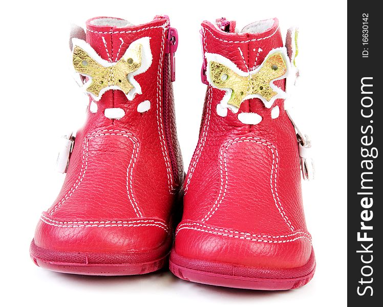 Pair red leather baby boots on white background