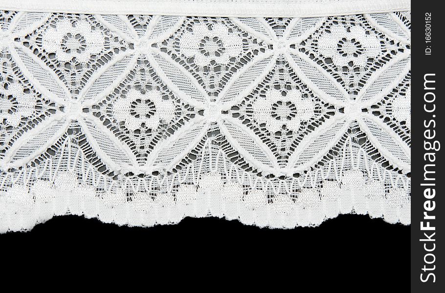 White lace with pattern in the manner of flower on black background
