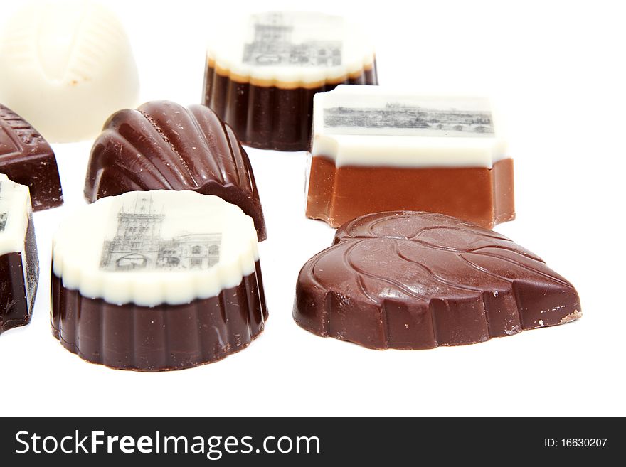 Chocolate sweetmeats with type of the Prague on white background