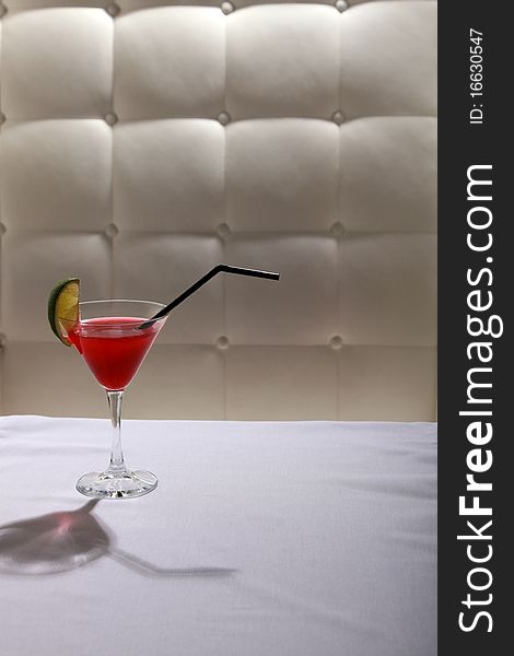 Glass with a cocktail on a light background