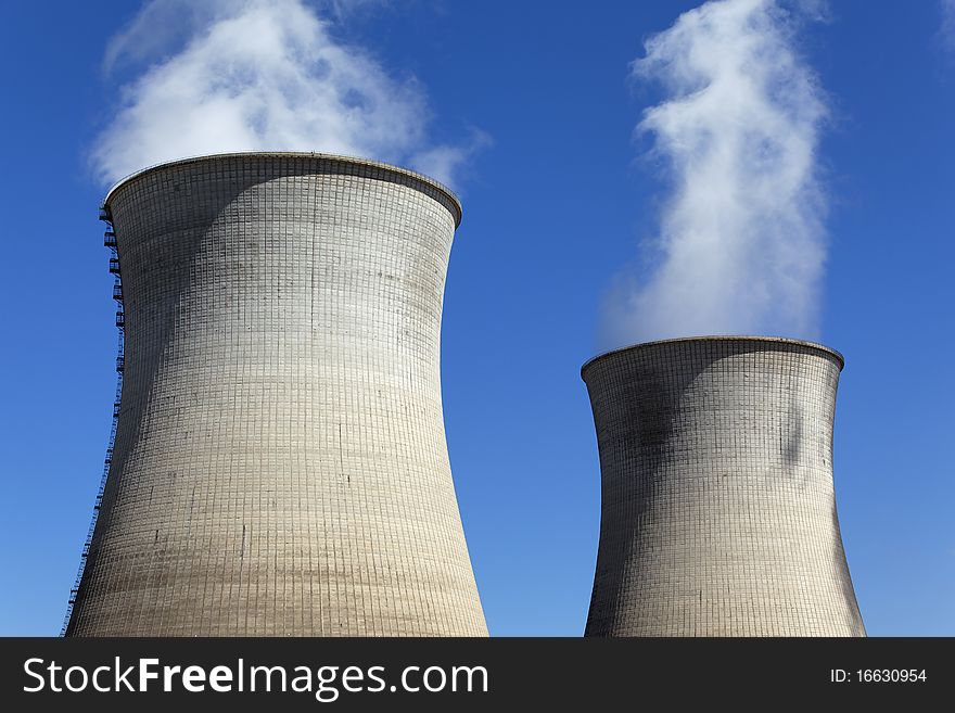 Chimney of nuclear industry and blue sky. Chimney of nuclear industry and blue sky
