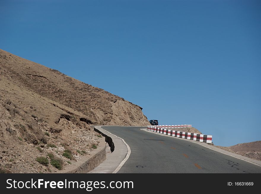 Yellowish mountain road view in tibet of China