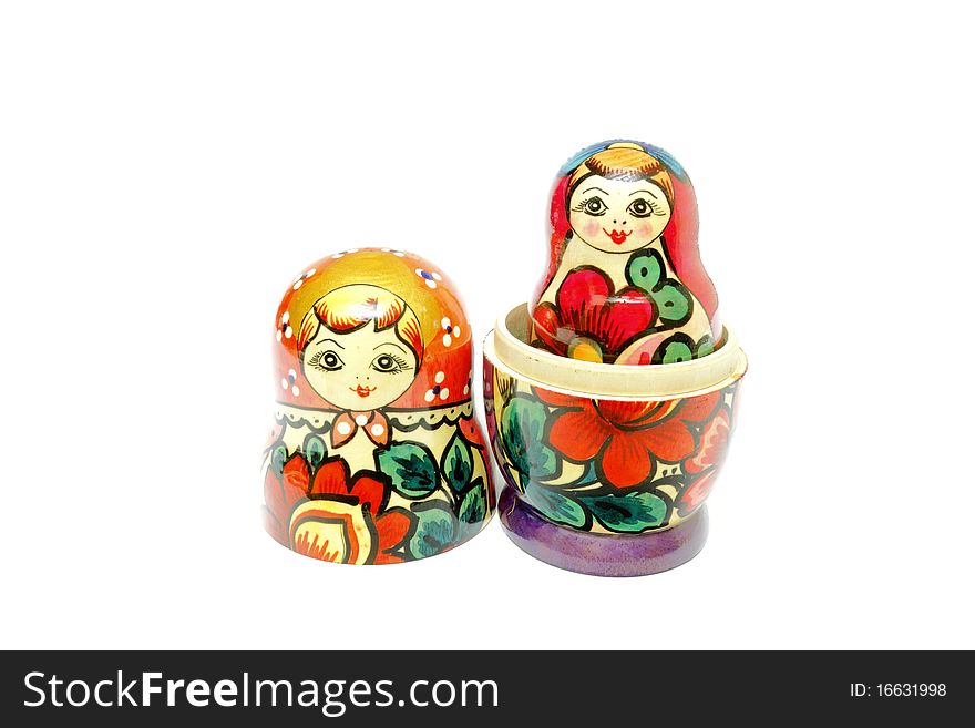 Nested dolls wooden painted by colors and patterns.