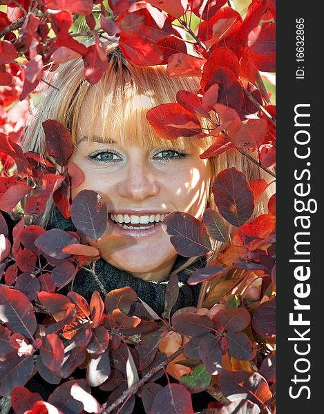 Woman, autumn, portrait of red leaves