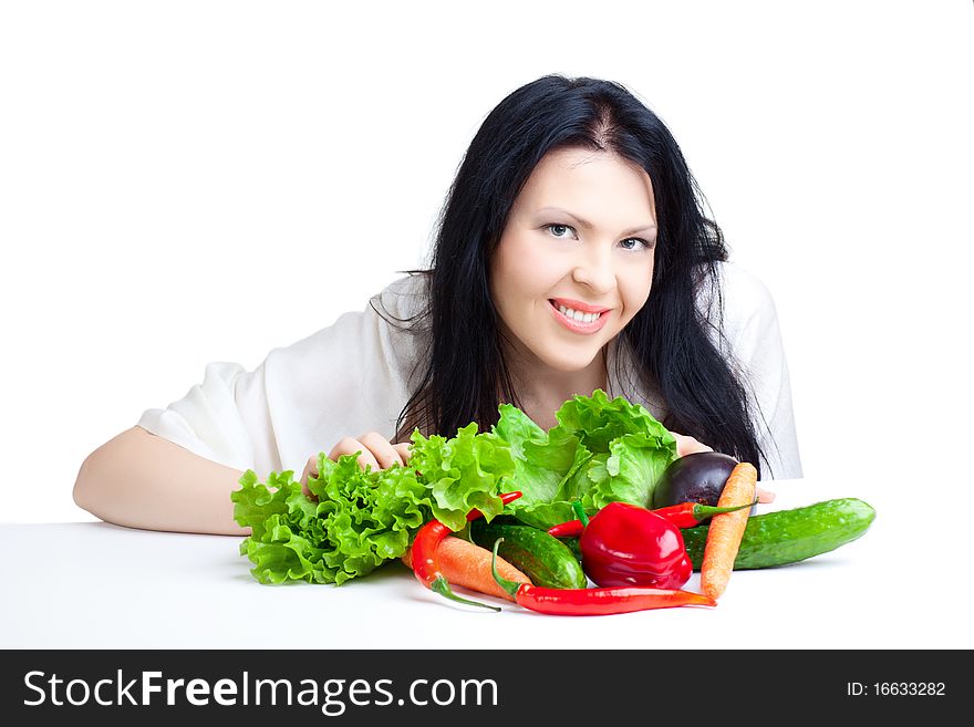 Beautiful woman with vegetables over white background. Beautiful woman with vegetables over white background