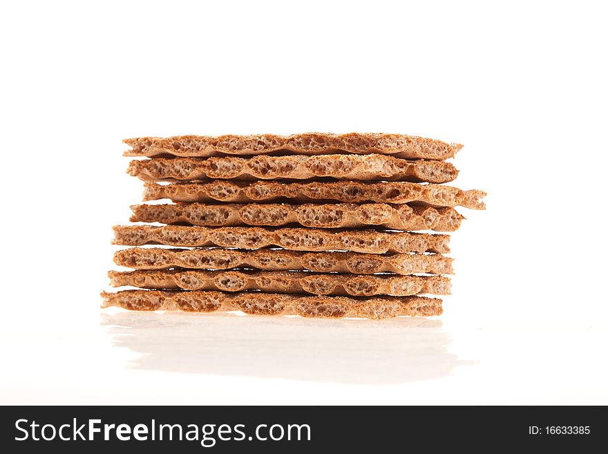 Pieces of dry bread crackers on a white background. Pieces of dry bread crackers on a white background