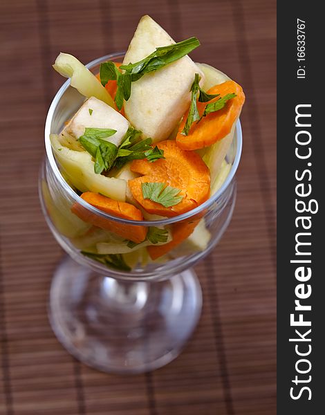 Glass full with pieces of carrot, green pepper and eggplant. Glass full with pieces of carrot, green pepper and eggplant