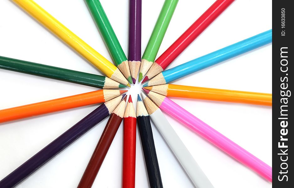 Multi-colored pencils laid on a circle. Multi-colored pencils laid on a circle