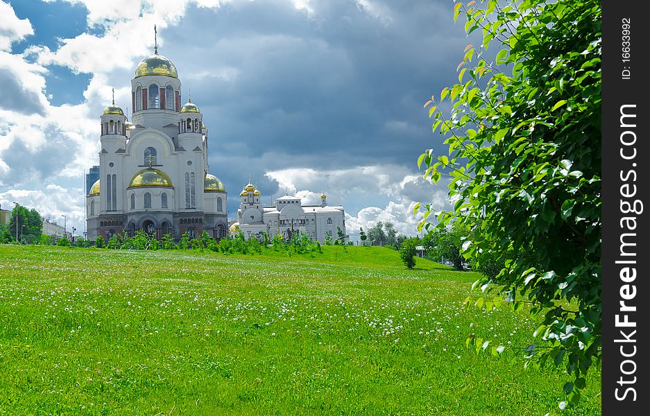 Horizontal imafe of beauty church on green meadow