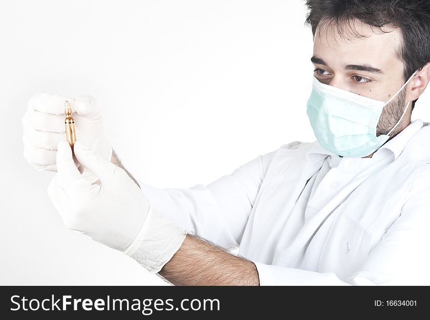 Doctor looking at ampule or vial isolated on white. Doctor looking at ampule or vial isolated on white