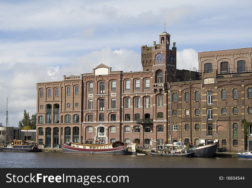 Historic warehouse at the Zaan river in the Netherlands. Historic warehouse at the Zaan river in the Netherlands