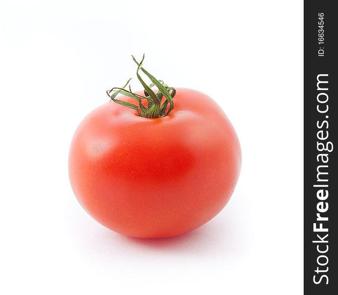 One isolated red tomato over white background