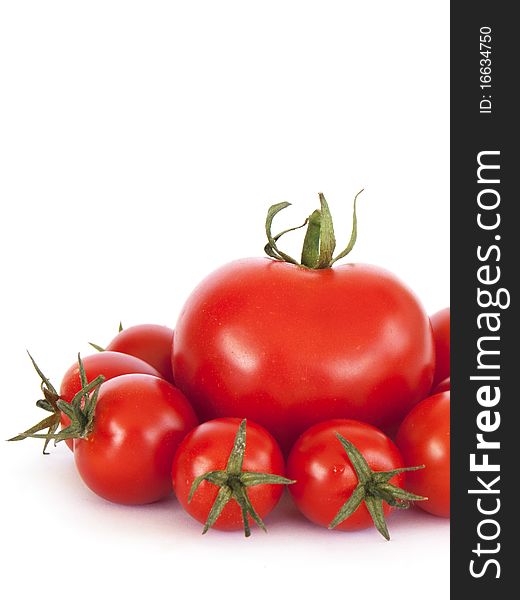 Tomato and cherry tomatoes on a withe background